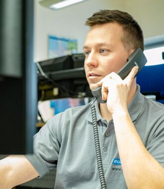 Dispatcher in the direct transport department takes transport orders on the phone